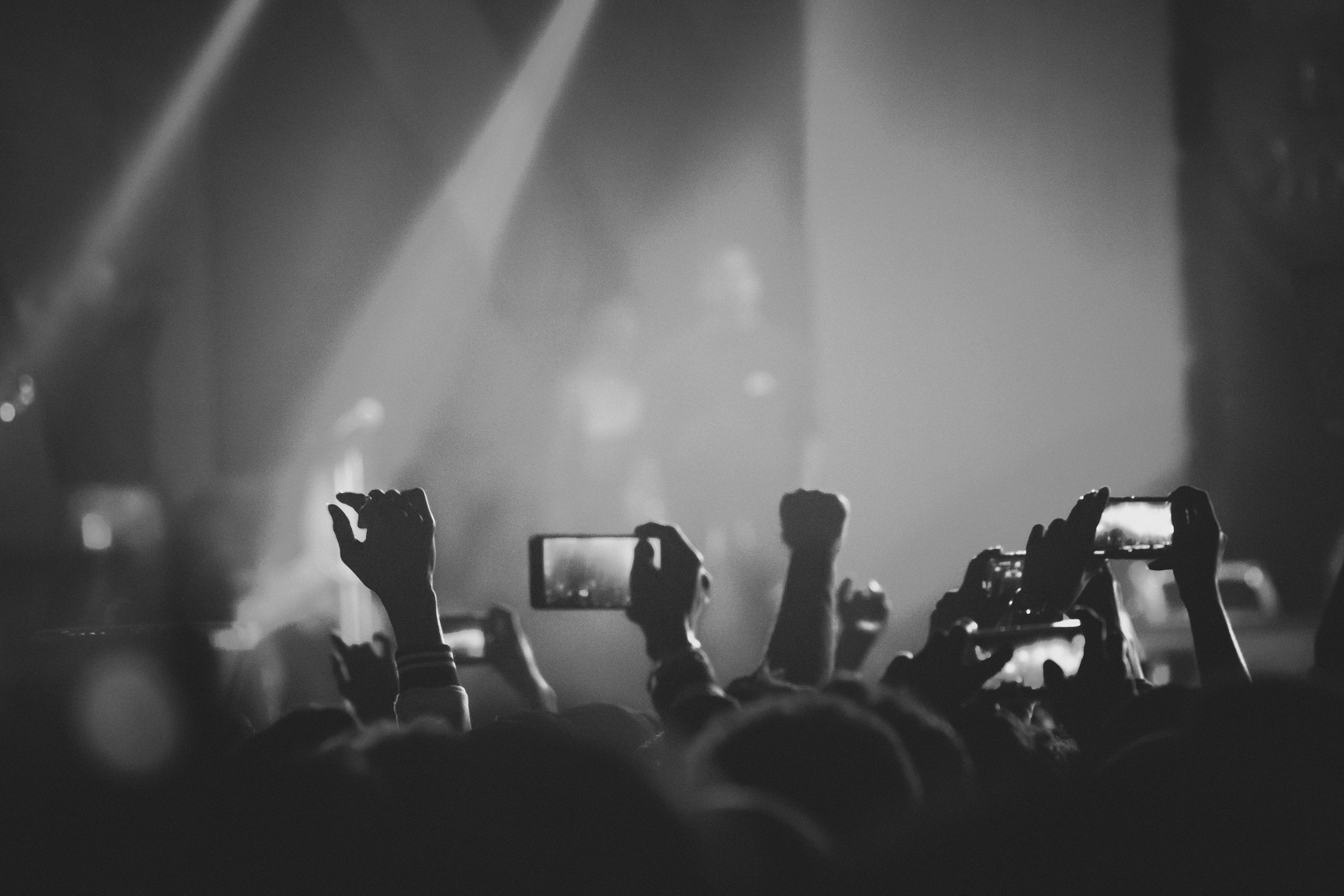 gig audience holding up phone cameras