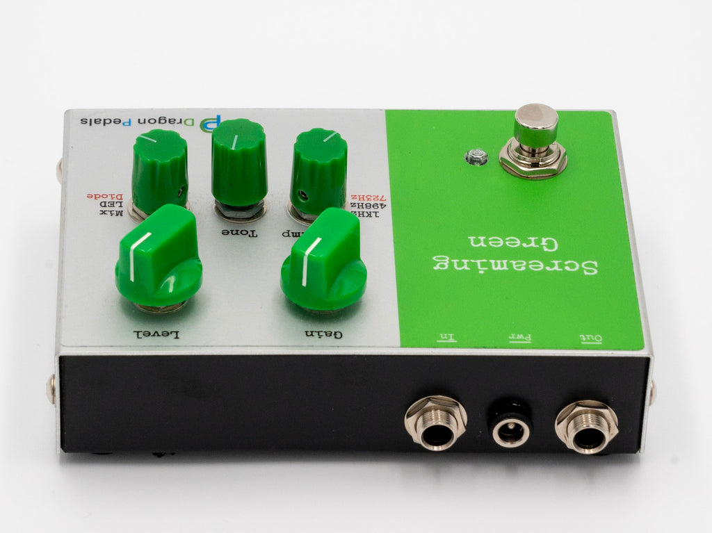 Green Tube Screamer guitar pedal with knobs and connectors